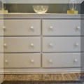 F49. Six-drawer white chest. 34&rdquo;h x 56&rdquo;w x 18&rdquo;d 